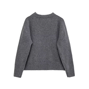 Women's loose dark grey knit sweater with wide ribbed cuffs and hem, back view display