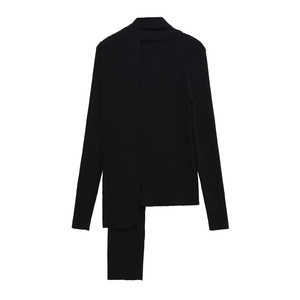 Detail of black ribbed knit sweater featuring a unique asymmetrical scarf-style neckline