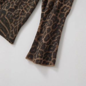 Women's leopard print long sleeve knit sweater with classic ribbed cuffs and animal pattern
