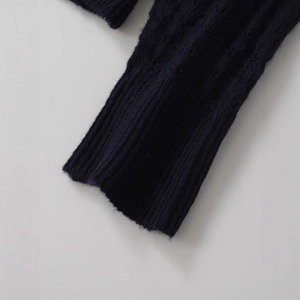 Classic dark blue cable knit sweater with ribbed cuffs and alpaca wool texture