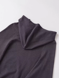 Close-up of the hood stitching and fine knit texture of this slim hooded dress