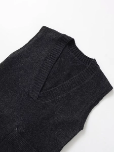 Detailed view of the ribbed V-neckline on this charcoal grey knitted sleeveless vest