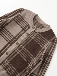 Detail of vintage brown plaid knit cardigan featuring ribbed crew neck and marble buttons