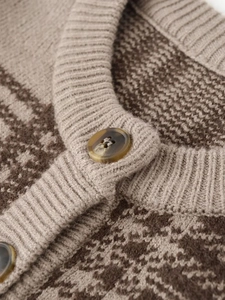 Close-up of checkered knit cardigan showing ribbed neckline and marble texture buttons