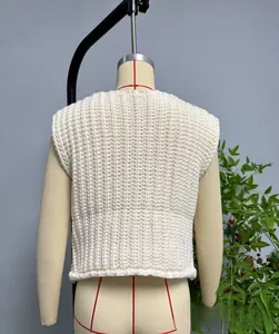 Back view of cream knit vest featuring a chunky vertical striped texture on mannequin