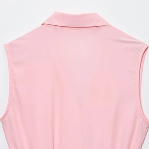 Detail of pink shirt dress showing the lapel collar and fine stitching on woven fabric