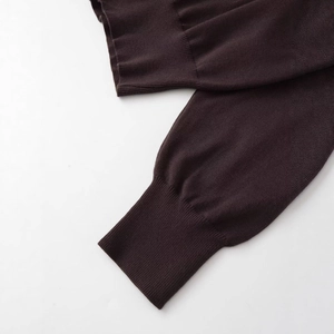 Minimalist chocolate brown knit hoodie featuring elastic ribbed cuffs and premium fabric