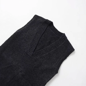 Classic charcoal grey V-neck knitted vest with thick ribbed texture and loose fit
