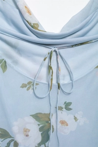 Detail of drawstring neckline on light blue floral print mesh mini dress