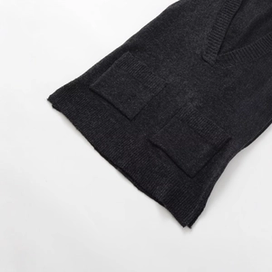 Women's charcoal grey V-neck knit vest with front patch pockets and ribbed texture
