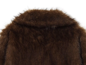 Detail of plush dark brown faux fur collar on a reversible jacket with soft texture