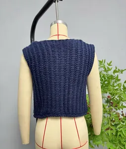 Detail of navy chunky knit vest showing vertical ribbed texture on a mannequin back
