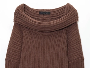 Detail of dark brown off-the-shoulder knit sweater featuring vertical ribbed texture