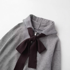 Grey knit hooded cardigan with decorative brown bows and front zipper closure