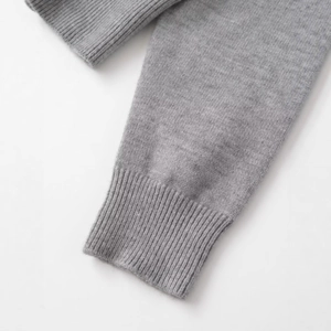 Gray knitted cardigan with ribbed cuffs and soft wool blend texture on white background