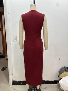 Detail view of back invisible zipper on burgundy sleeveless midi dress showing seam line