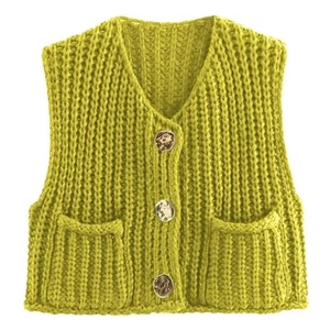 Detail of V-neck knitted vest featuring vintage buttons and textured patch pockets