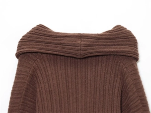 Close-up of deep brown ribbed knit sweater showing off-shoulder collar and fabric texture