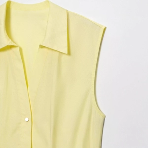 Pale yellow sleeveless poplin midi dress with V-neckline and belted waist detail