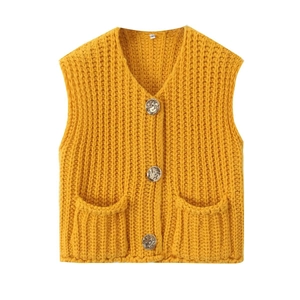 Detail of yellow V-neck knit vest featuring large silver buttons and side patch pockets