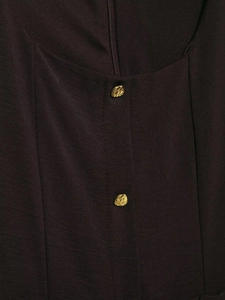 Detail of deep brown midi dress featuring U-neckline and hammered gold buttons