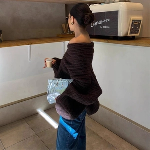 Women's dark brown off-shoulder knit sweater with oversized fit and ribbed texture