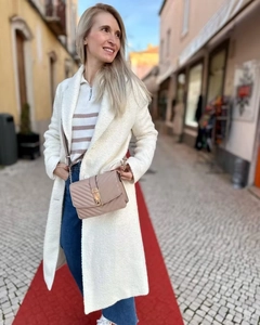 Detail of off-white faux shearling coat with lapel and soft textured fabric for women
