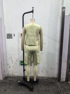 Back view of a light green sleeveless vest and shorts set for women in cotton linen