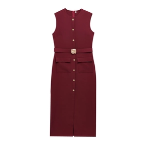Detail of burgundy midi dress with gold buttons, matching belt and front slit