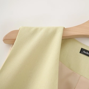 Detailed close-up of light green woven fabric texture and premium inner lining