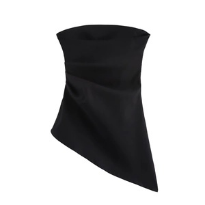 Detail of black satin strapless top featuring asymmetrical hem and pleated waist fabric
