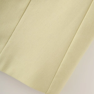 Detail shot of premium linen-cotton fabric texture and fine stitching on the vest set