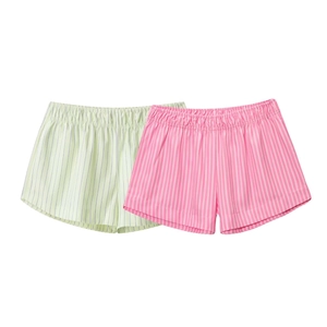 Close-up of striped poplin shorts with elastic waistband in pink and green colors