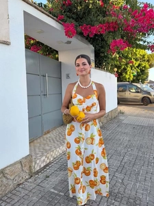 Detailed halter neck maxi dress with orange fruit print and button front on white linen
