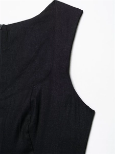 Close-up of black linen sleeveless dress with visible texture and hidden zipper detail