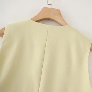 Detailed texture of sleeveless cotton linen vest with clean seams and unlined neckline