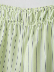 Detail view of the striped poplin shorts featuring a flexible elastic waistband and stitching