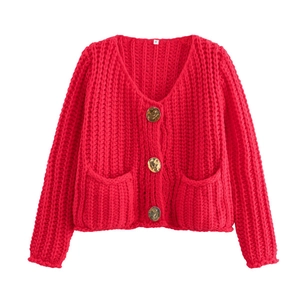 Red chunky knit cardigan featuring deep V-neck and tortoiseshell buttons in flat lay view