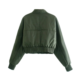 Detail of olive green bomber jacket back with decorative stitching and elastic hem