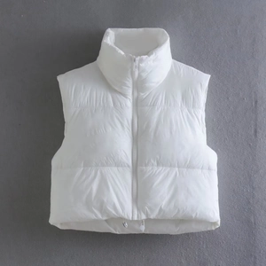 Close-up of a white padded puffer vest with high collar and adjustable hem drawstrings