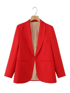 Detailed view of shawl collar and beige lining on red open front blazer jacket