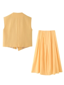 Detail of yellow cotton linen vest set with irregular hem and A-line midi skirt