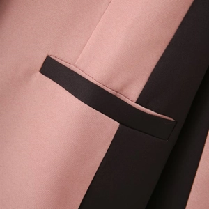 Detail of premium twill fabric showing pink and black contrast stitching and flat welt pocket