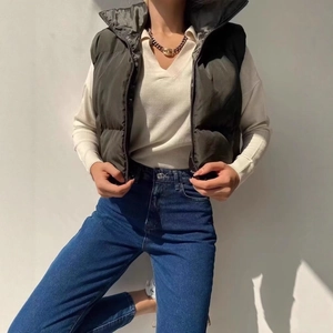 Women's dark olive cropped puffer vest with stand collar and zipper closure