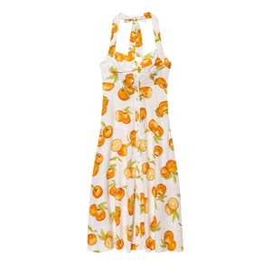 White halter midi dress with vibrant orange citrus print and button-down front details