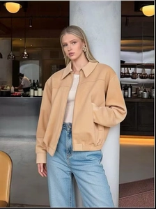 Chic women's faux suede bomber jacket in beige featuring a classic lapel and zip closure