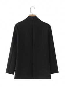 Rear view of a black blazer with shawl collar showing premium fabric and sleek tailoring