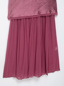 Detail of dark berry pink pleated midi dress featuring silk texture and chiffon patchwork