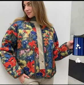 Detail of floral quilted cotton jacket featuring retro patterns and buttoned front