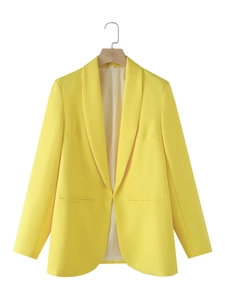 Detailed view of women's bright yellow shawl collar blazer with minimalist welt pockets
